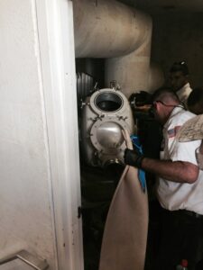 Plumber performing pipe relining for damaged sewer line