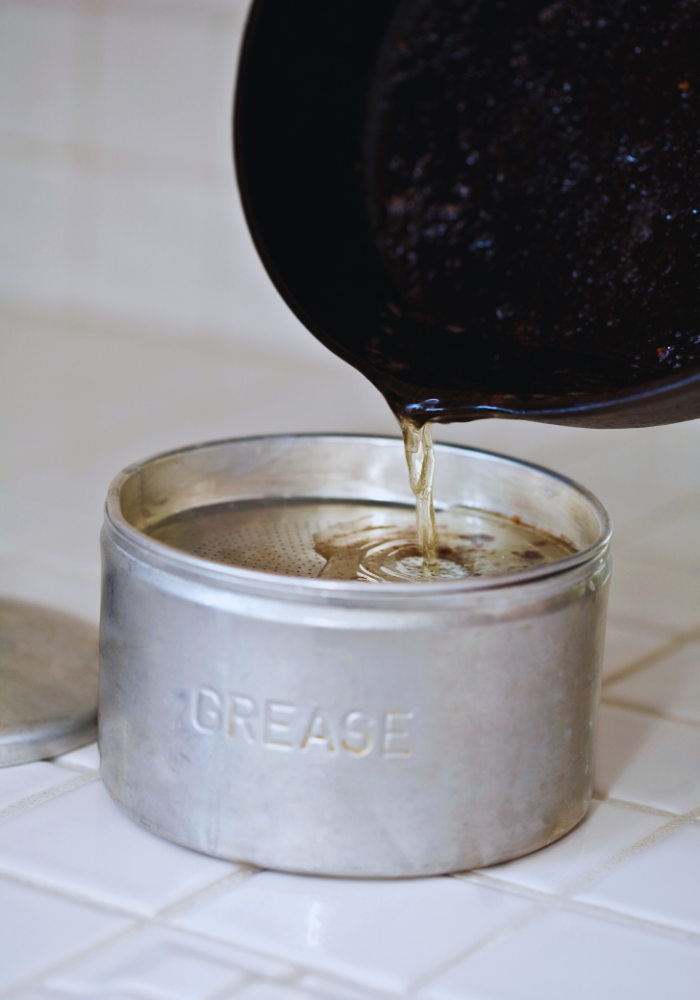 Fats oil and grease being poured into container