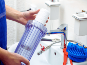 Plumber installing whole home water filtration system