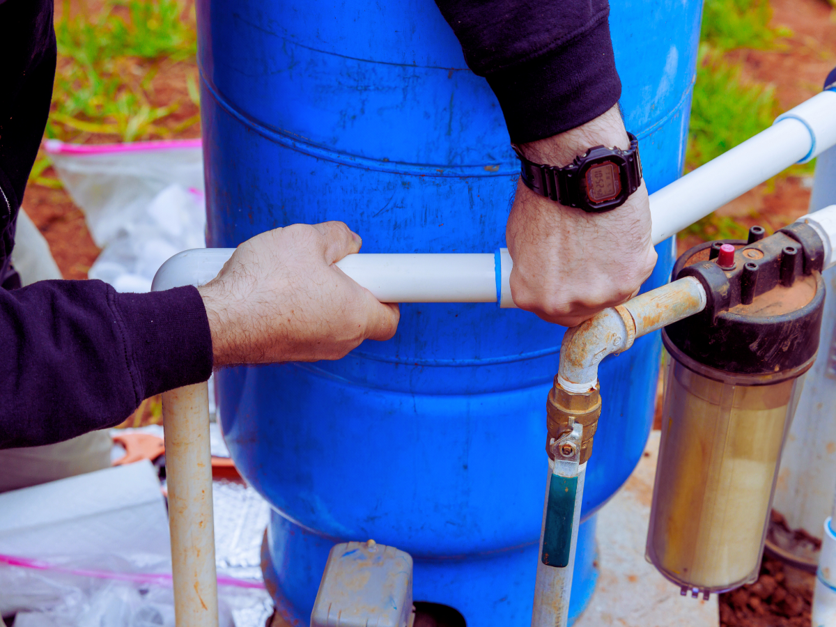 homeowner maintaining well pump